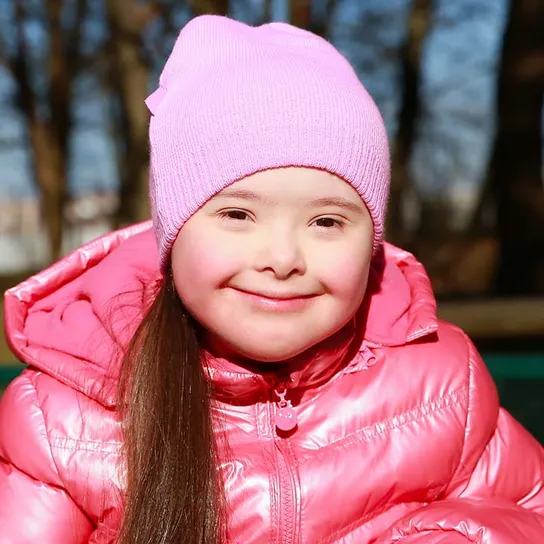 Young girl sitting outside