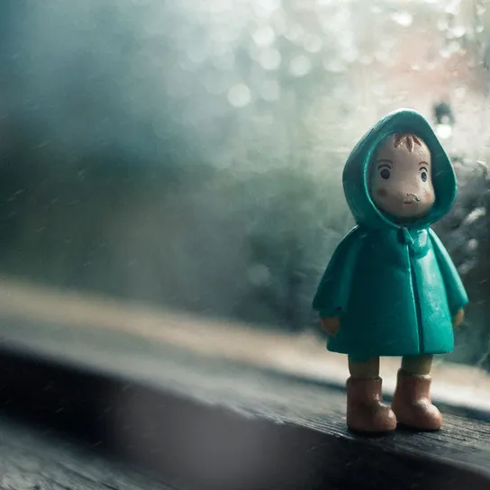 Figurine of a boy in the rain